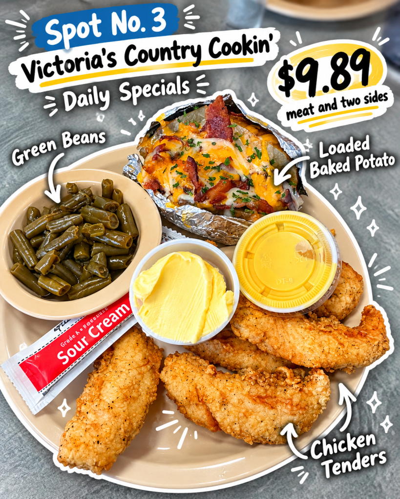 A plate featuring chicken tenders, a loaded baked potato topped with cheese and bacon, green beans, sour cream, and butter. The meal is part of a daily special at Victoria's Country Cookin', priced at $9.89.