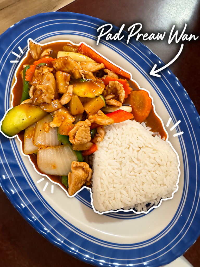 Plate of Pad Preaw Wan, featuring stir-fried chicken with mixed vegetables in a sweet sauce, accompanied by a serving of fluffy white rice.